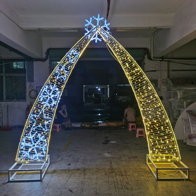 This is an oversized pre-lit walk-through snowflake arch decoration with LEDs for outdoor commercial projects. Picture of Certified Lights' Large outdoor Holiday Decorations. 