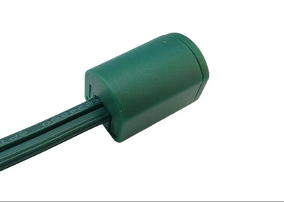 Side profile of green SPT-1 cord cap for outdoor-rated Christmas light strand termination – 100-pack