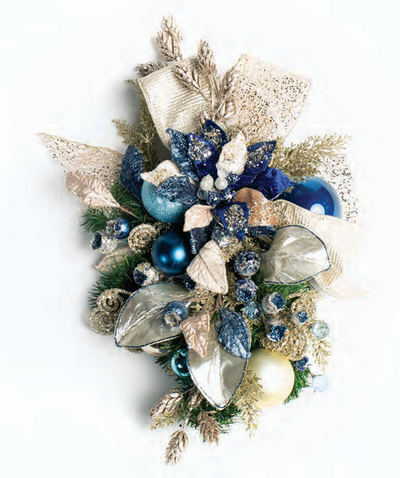 Elegant holiday spray featuring navy, silver, and champagne decorations with sparkling poinsettia and baubles
