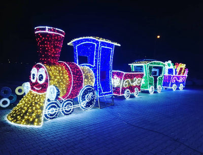 A brightly colored, pre-lit LED train designed for Christmas decorations, featuring multiple cars with different colors.
